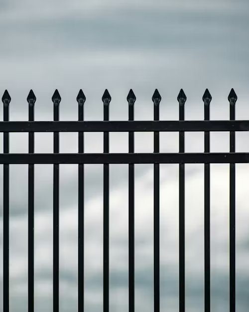 Black aluminum fence with decorative spear tops