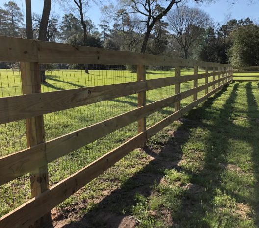 Four-rail ranch fence with welded wire backing by ProGuard Fencing