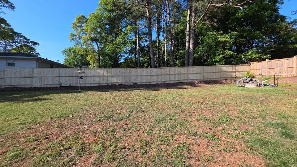 Wood privacy fence installation